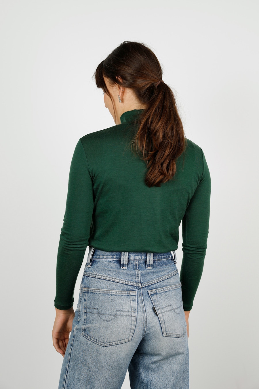 Two green merino papercut rise turtleneck side