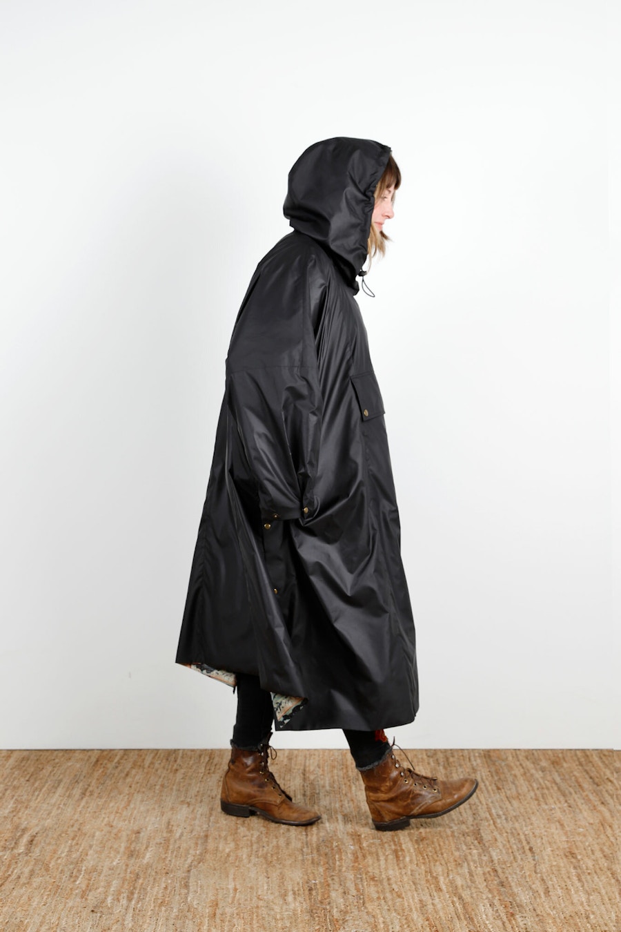 Becca Assembly Line Hoodie Poncho Black Side Hood Up Walk