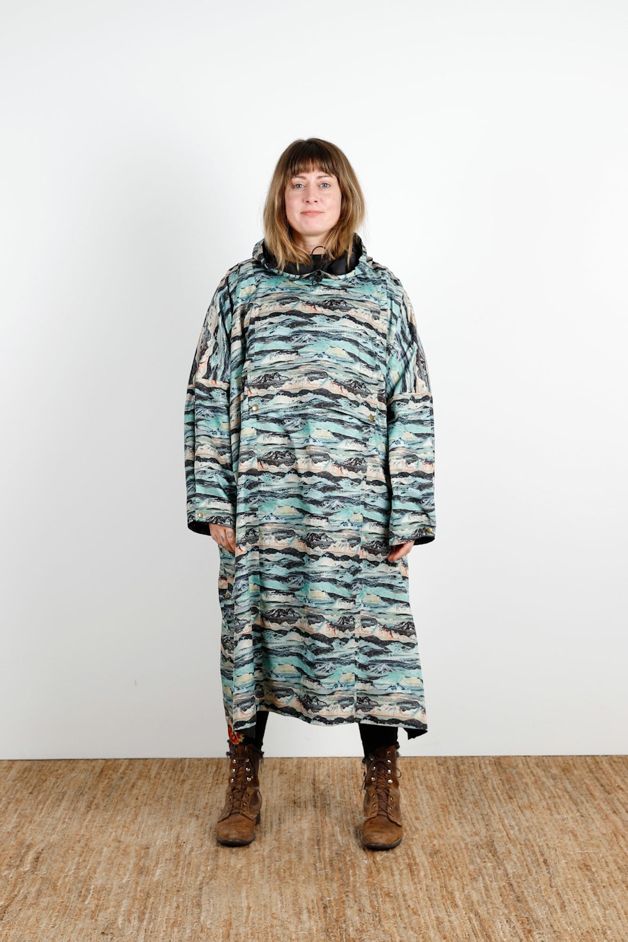 Becca Assembly Line Hoodie Poncho Liberty Front Stand
